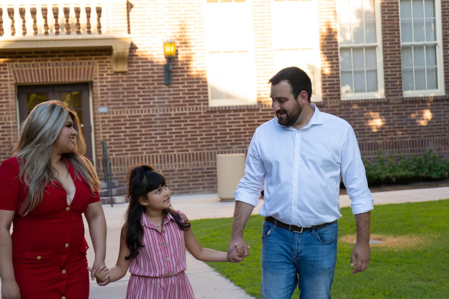 Nabil walking with his partner and daughter